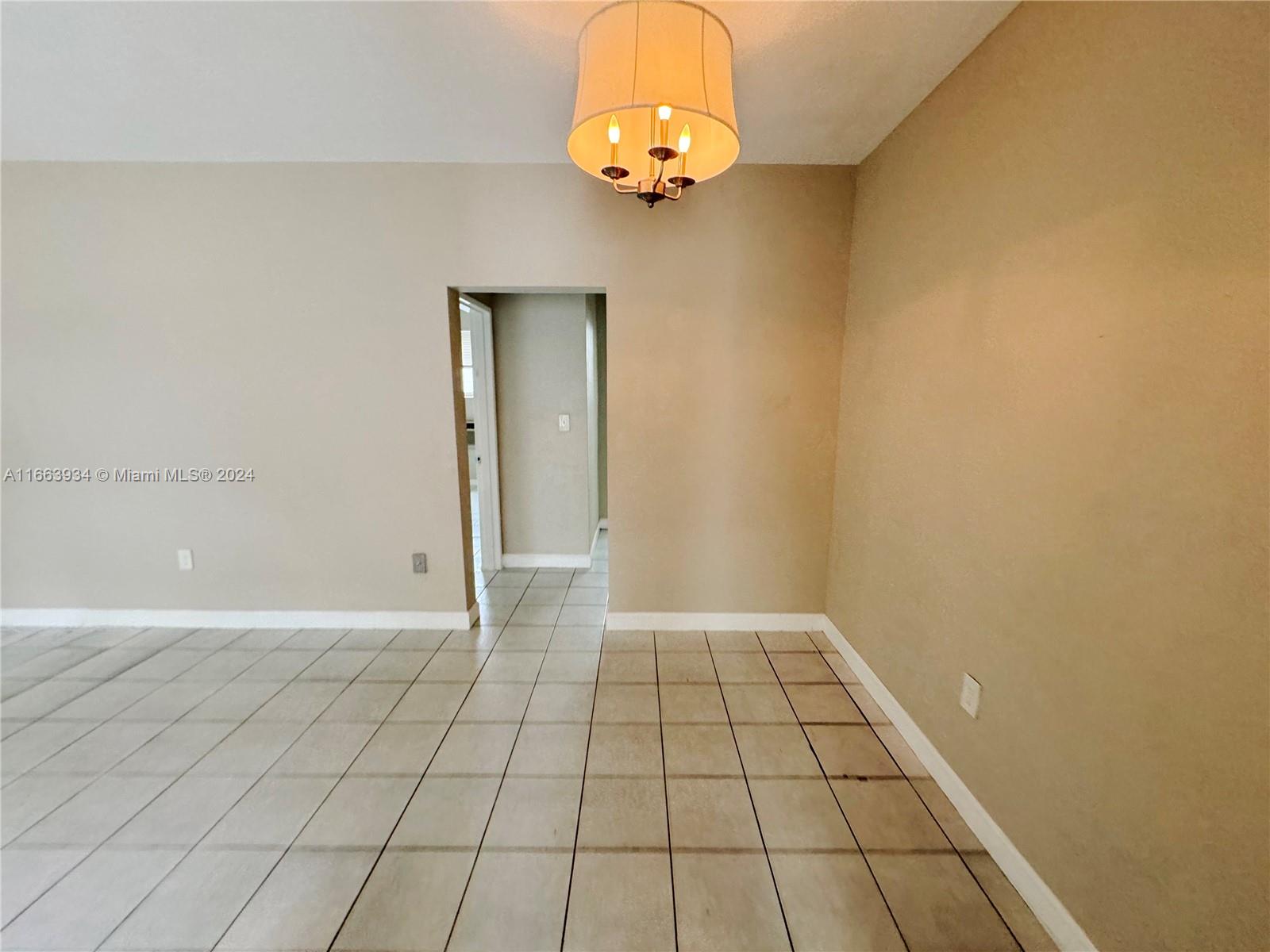 620 76th Street, Unit 7 Miami Beach, FL 33141 - Photo 10 of 17 a view of an empty room and window
