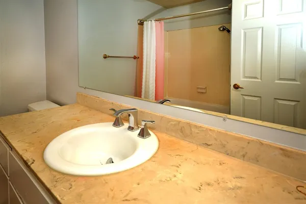 a bathroom with a bathtub and a sink