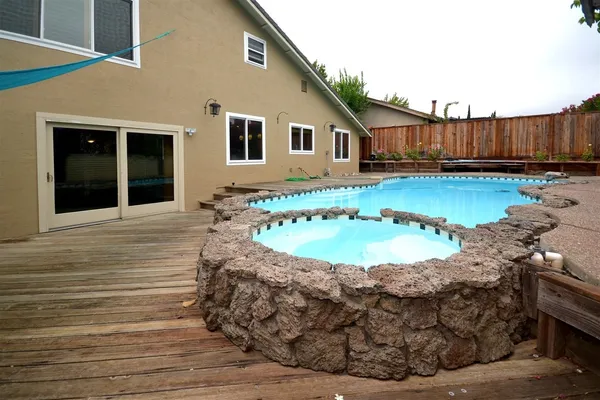a view of a backyard of the house