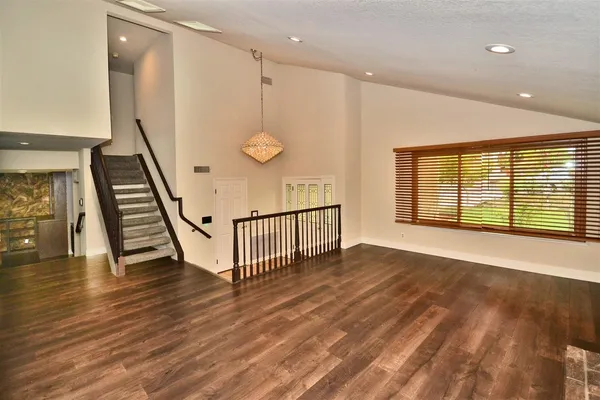 a view of an entryway with wooden floor