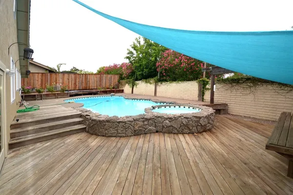 a view of a backyard of the house