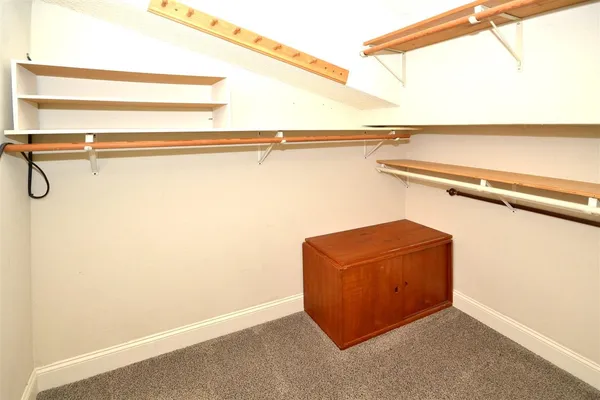 a view of a room with racks on the wall