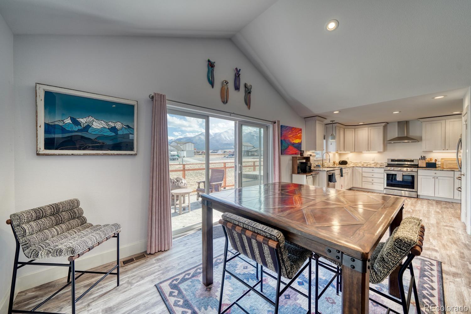 148 Grouse Road Buena Vista, CO 81211 - Photo 11 of 37 a dining room with furniture and wooden floor