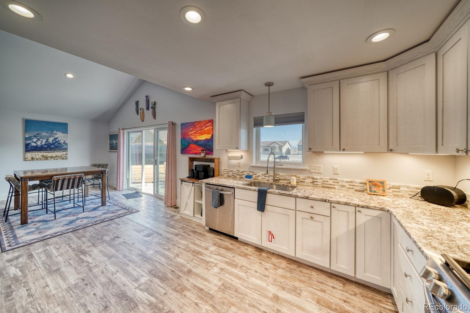 148 Grouse Road Buena Vista, CO 81211 - Photo 12 of 37 a kitchen with a sink window and cabinets