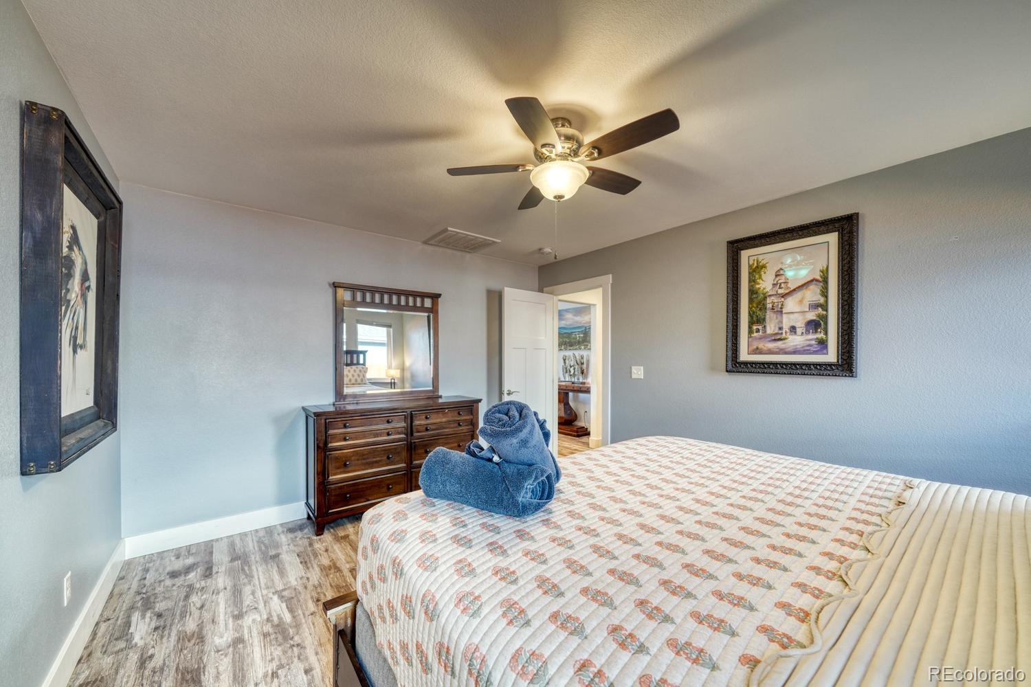 148 Grouse Road Buena Vista, CO 81211 - Photo 16 of 37 a bedroom with a large bed and a window