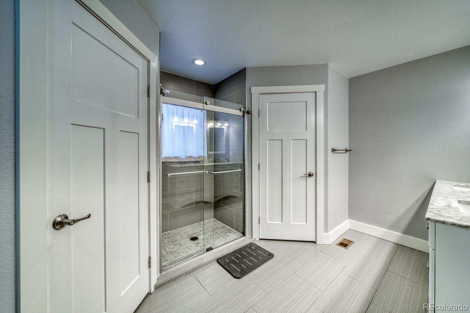 148 Grouse Road Buena Vista, CO 81211 - Photo 19 of 37 a bathroom with a double vanity sink and mirror