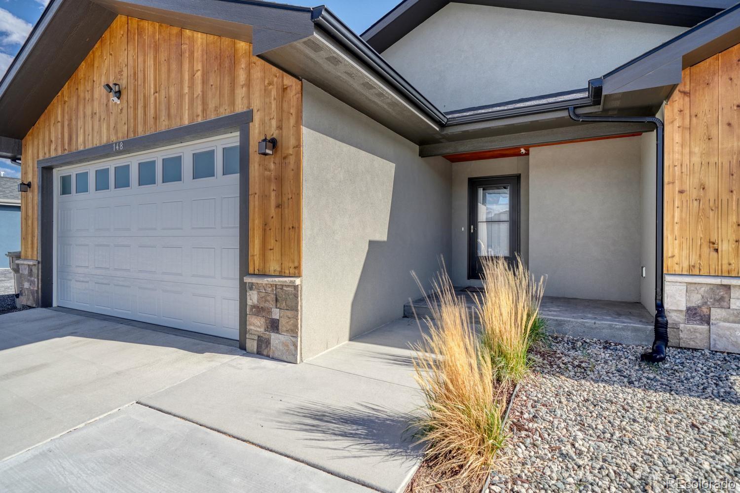 148 Grouse Road Buena Vista, CO 81211 - Photo 3 of 37 a front view of a house with a outdoor