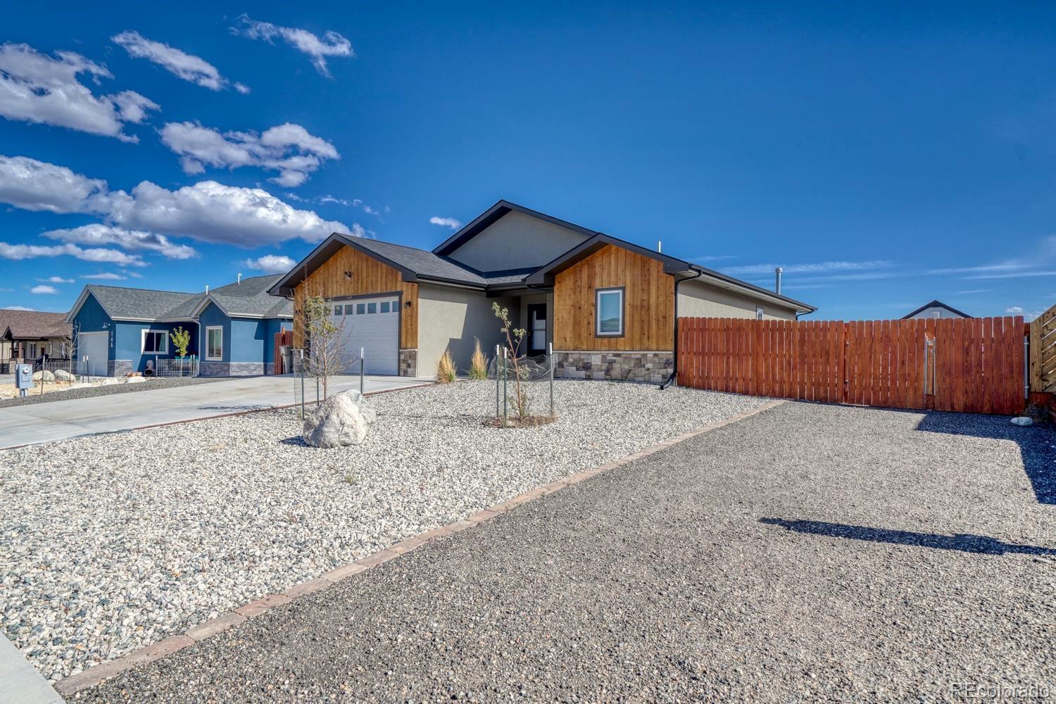 148 Grouse Road Buena Vista, CO 81211 - Photo 4 of 37 a front view of a house with a yard