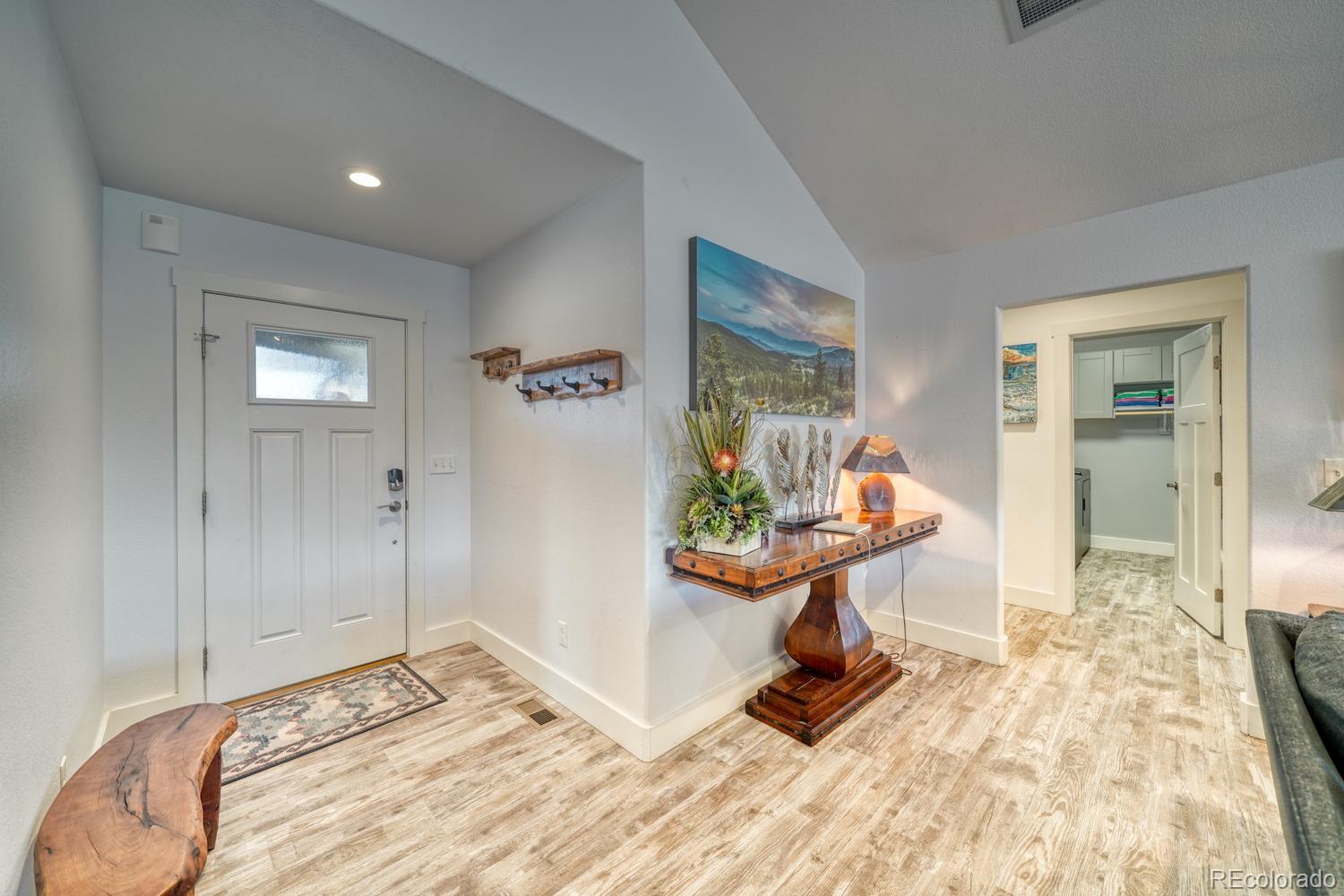 148 Grouse Road Buena Vista, CO 81211 - Photo 6 of 37 a bedroom with a bed and a potted plant