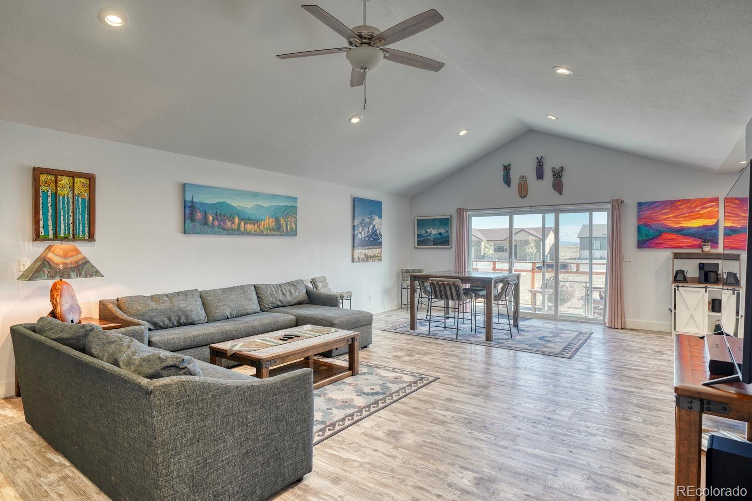 148 Grouse Road Buena Vista, CO 81211 - Photo 7 of 37 a living room with furniture and a flat screen tv