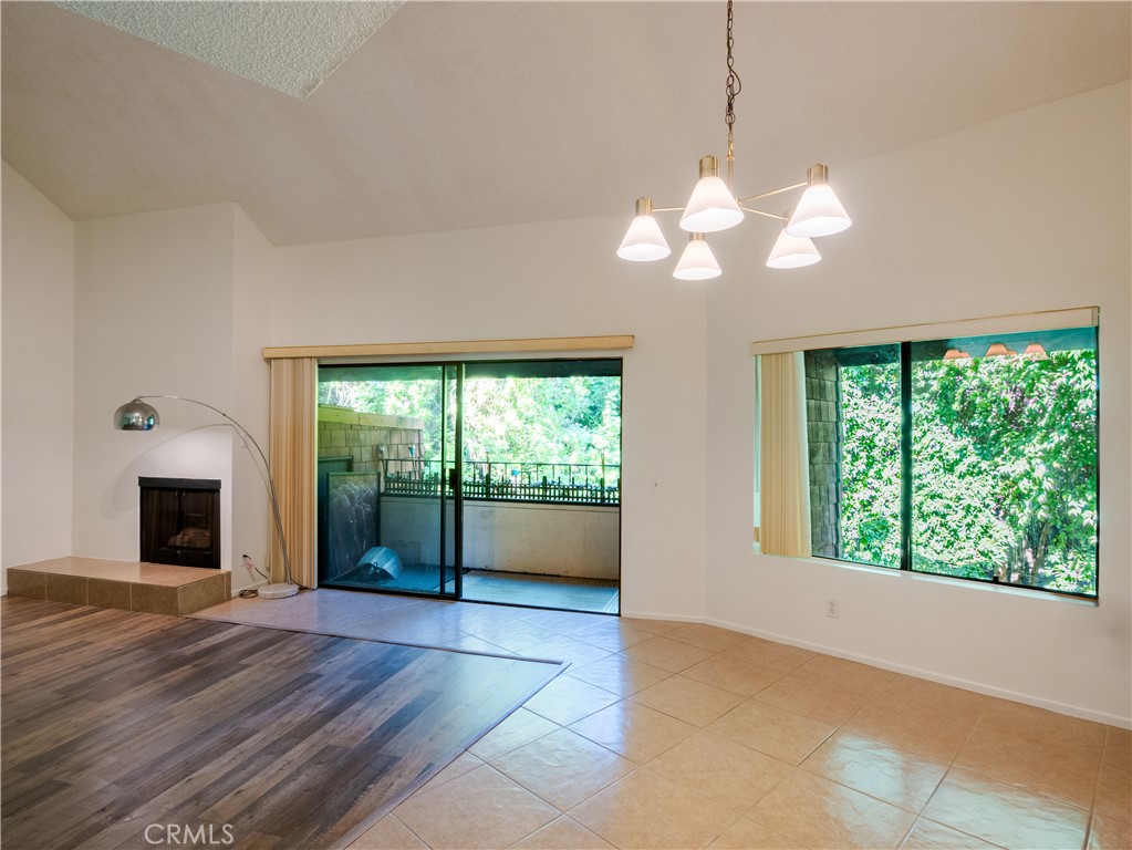 380 South Prospectors Road, Unit 91 Diamond Bar, CA 91765 - Photo 1 of 1 a view of an empty room with window and chandelier fan
