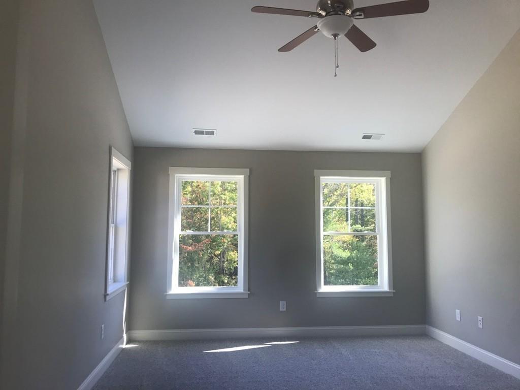 56 Clement Road Townsend, MA 01474 - Photo 12 of 23 an empty room with a window and a fan