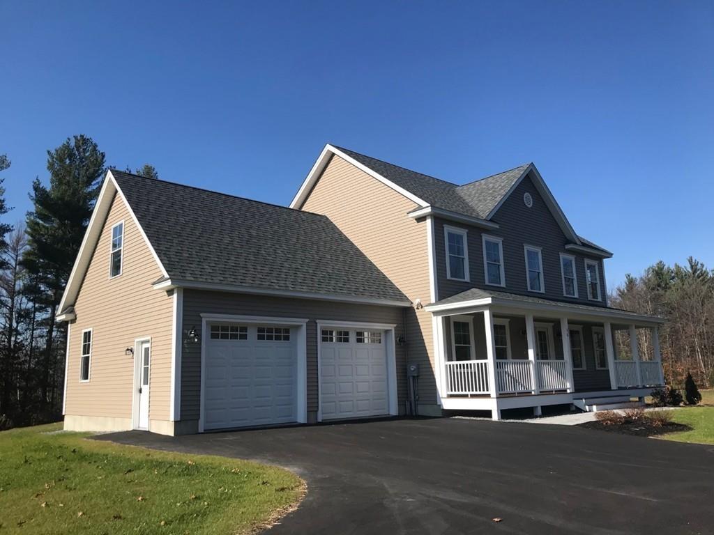 56 Clement Road Townsend, MA 01474 - Photo 2 of 23 a front view of a house with a yard