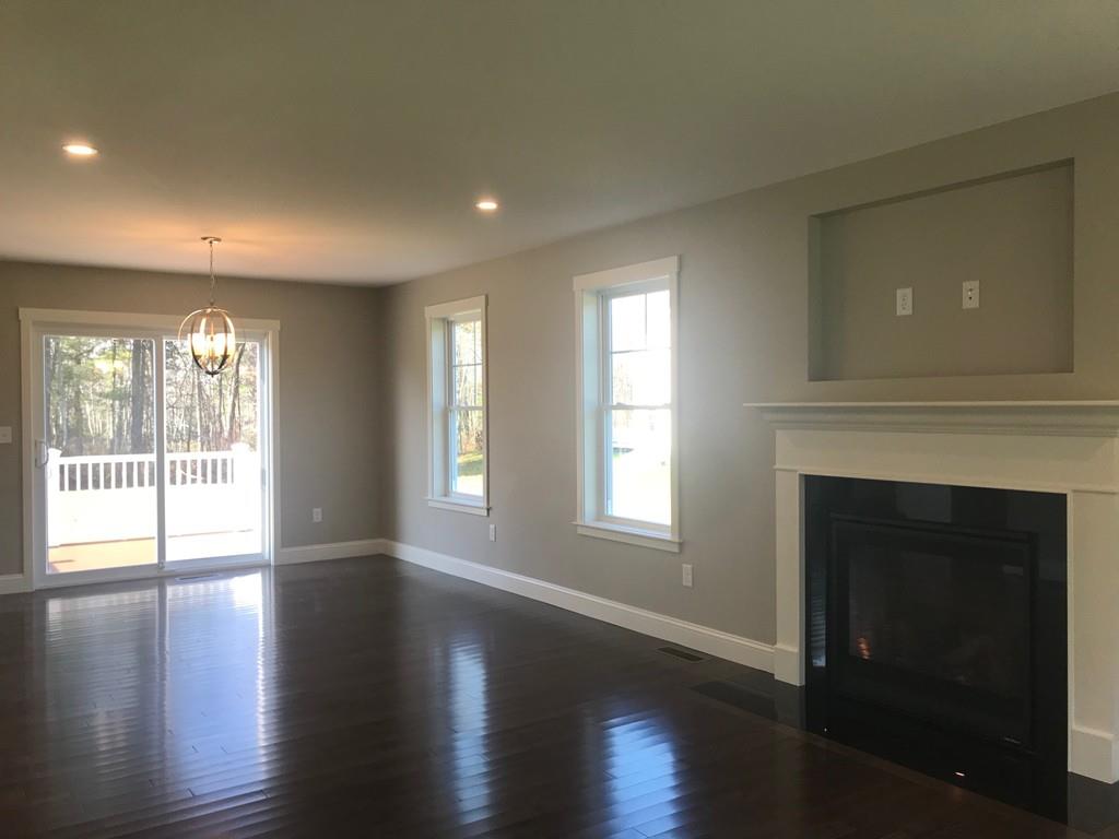 56 Clement Road Townsend, MA 01474 - Photo 22 of 23 a view of an empty room with wooden floor and a window