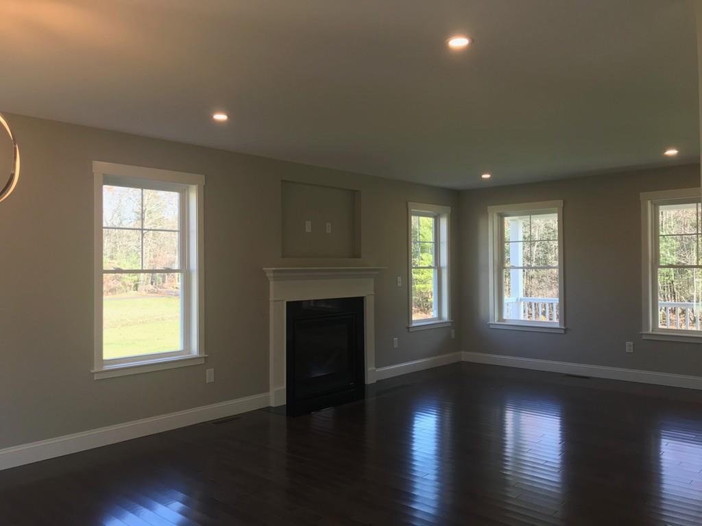 56 Clement Road Townsend, MA 01474 - Photo 23 of 23 a view of an empty room with wooden floor and a window