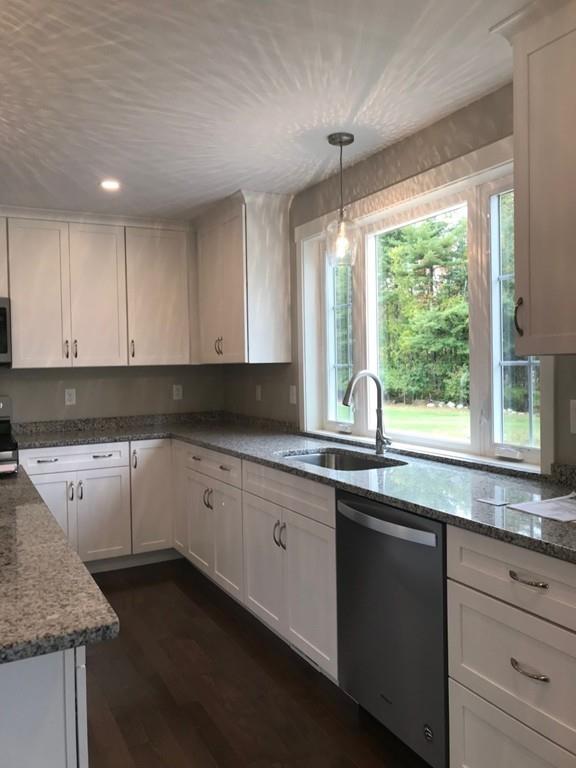 56 Clement Road Townsend, MA 01474 - Photo 7 of 23 a kitchen with granite countertop white cabinets window and sink