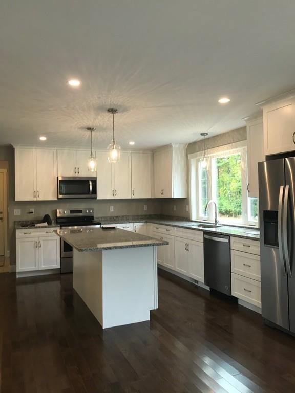 56 Clement Road Townsend, MA 01474 - Photo 8 of 23 a kitchen with stainless steel appliances granite countertop refrigerator sink and stove top oven