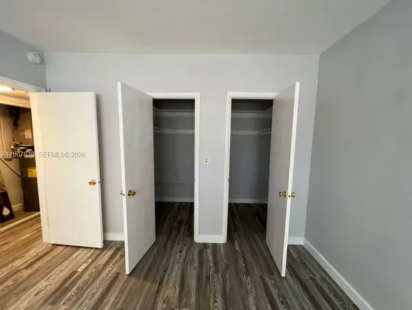 a view of balcony with wooden floor