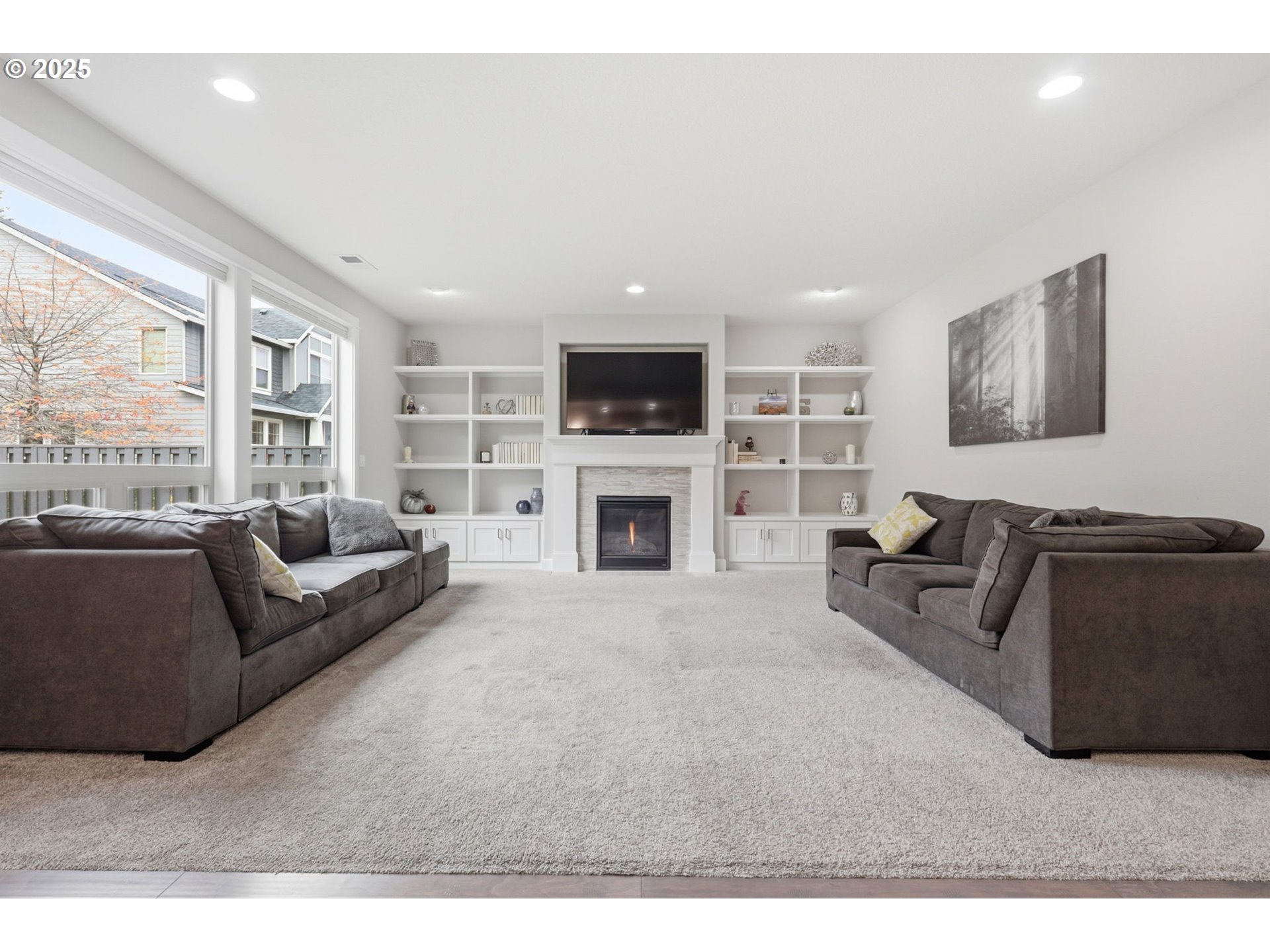 28337 Southwest Morningside Avenue Wilsonville, OR 97070 - Photo 12 of 48 a living room with furniture a flat screen tv and a fireplace