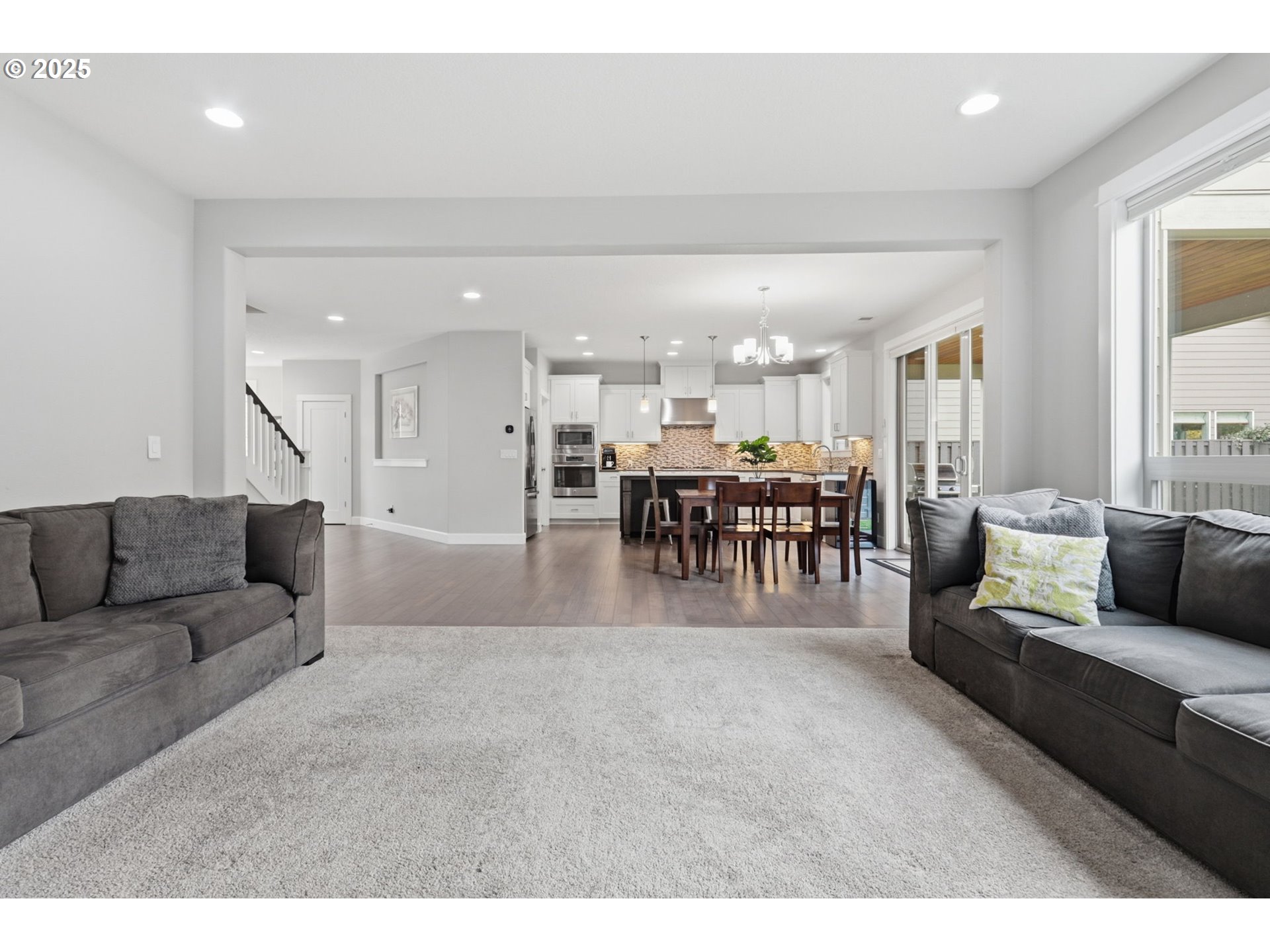 28337 Southwest Morningside Avenue Wilsonville, OR 97070 - Photo 14 of 48 a living room with furniture and a dining table