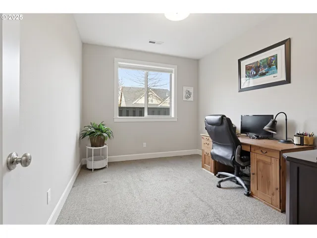 a workspace with furniture and window