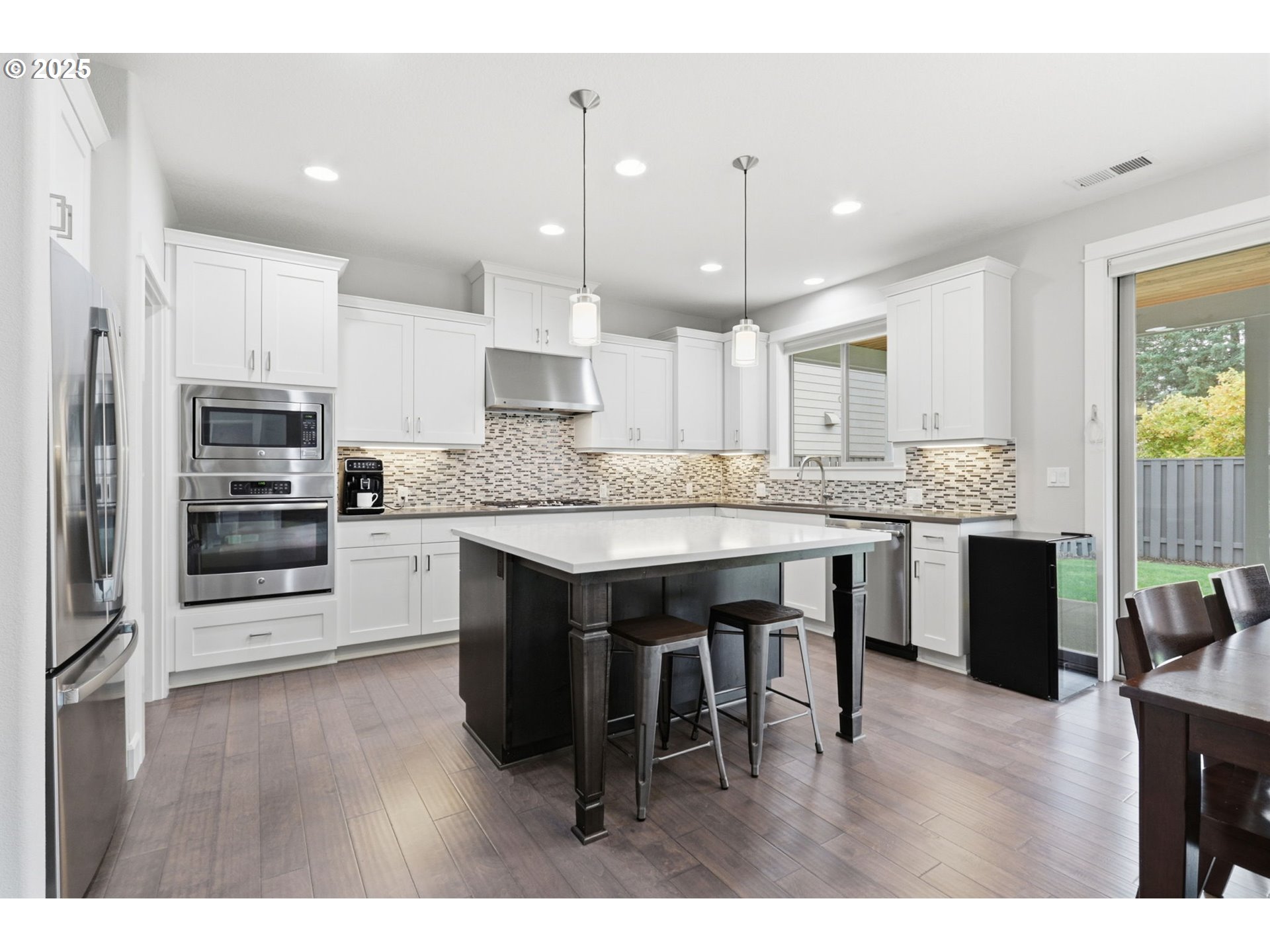 28337 Southwest Morningside Avenue Wilsonville, OR 97070 - Photo 3 of 48 a kitchen with stainless steel appliances kitchen island granite countertop a stove a sink a refrigerator and a cabinets