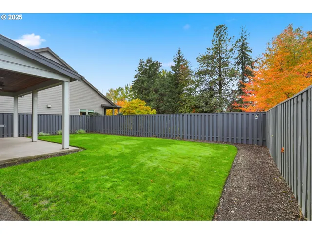 a view of an empty room with floor to ceiling window