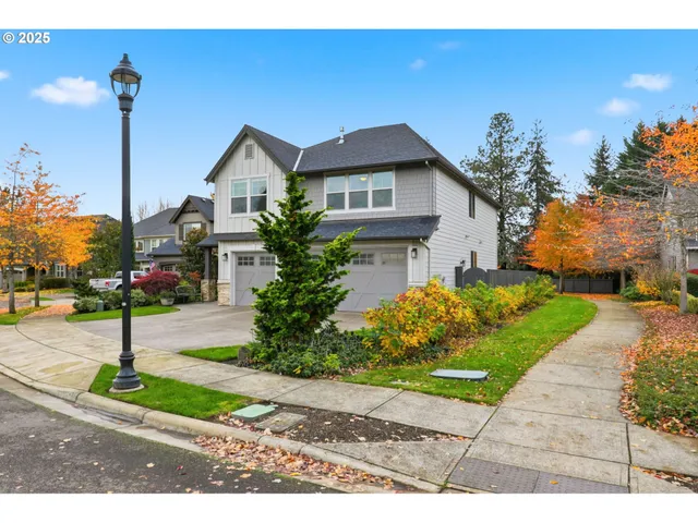 a front view of a house with a yard table and chairs