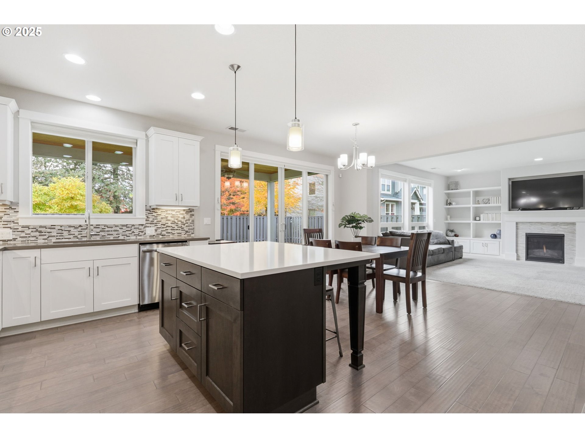 28337 Southwest Morningside Avenue Wilsonville, OR 97070 - Photo 5 of 48 a kitchen with lots of counter space a sink appliances and dining table