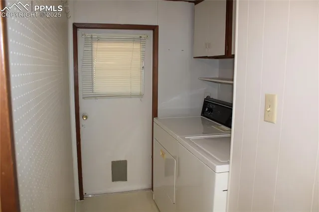 a utility room with washer and dryer
