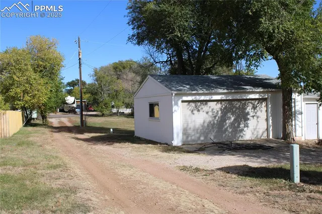a view of a house with a tree