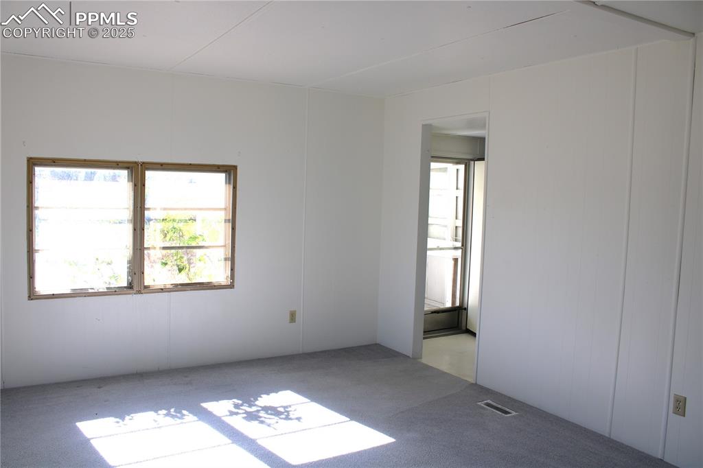 8320 Piute Road Colorado Springs, CO 80926 - Photo 6 of 20 an empty room with windows