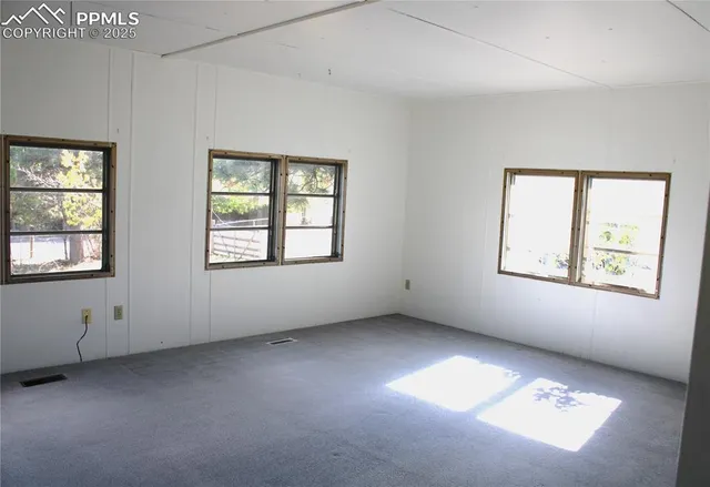 an empty room with windows