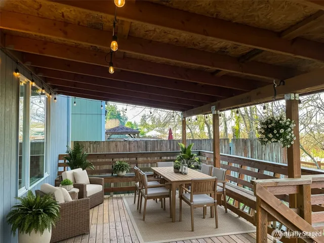 a view of a patio with wooden floor