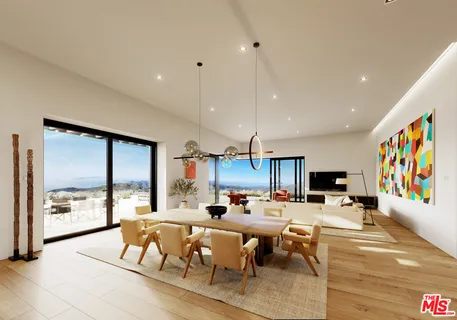 a kitchen with a sink and chairs