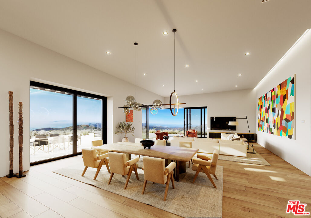 9522 Cotharin Road Malibu, CA 90265 - Photo 16 of 25 a living room with furniture kitchen view and a large window