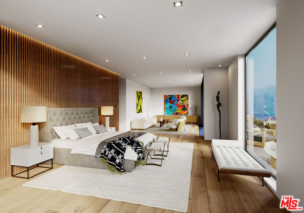 9522 Cotharin Road Malibu, CA 90265 - Photo 20 of 25 a bedroom with furniture a bed and a flat screen tv