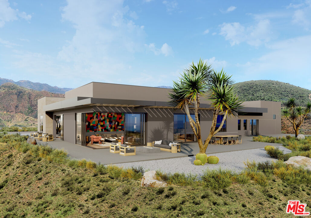 9522 Cotharin Road Malibu, CA 90265 - Photo 22 of 25 a view of a chairs and tables in patio