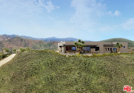 a view of a house with pool and a yard