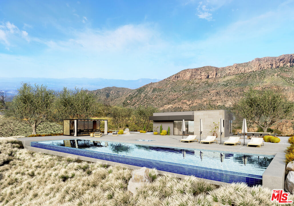 9522 Cotharin Road Malibu, CA 90265 - Photo 25 of 25 a view of a house with pool and a yard