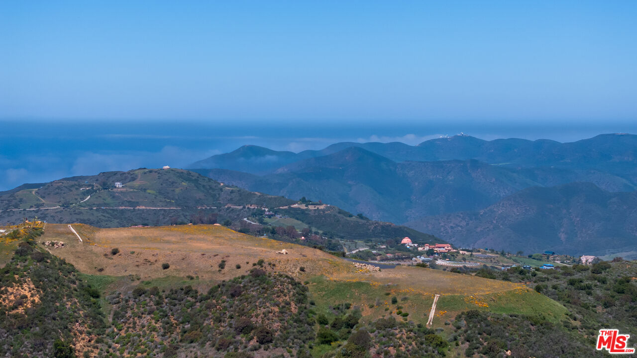 9522 Cotharin Road Malibu, CA 90265 - Photo 8 of 25 a view of lake with mountain