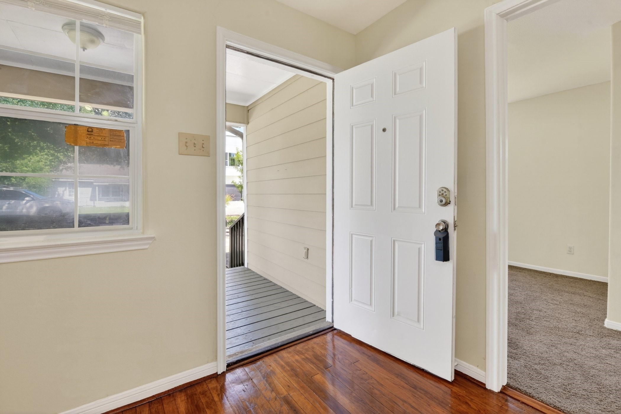7013 St Augustine Street Houston, TX 77021 - Photo 8 of 35 a view of a hallway with wooden floor and staircase