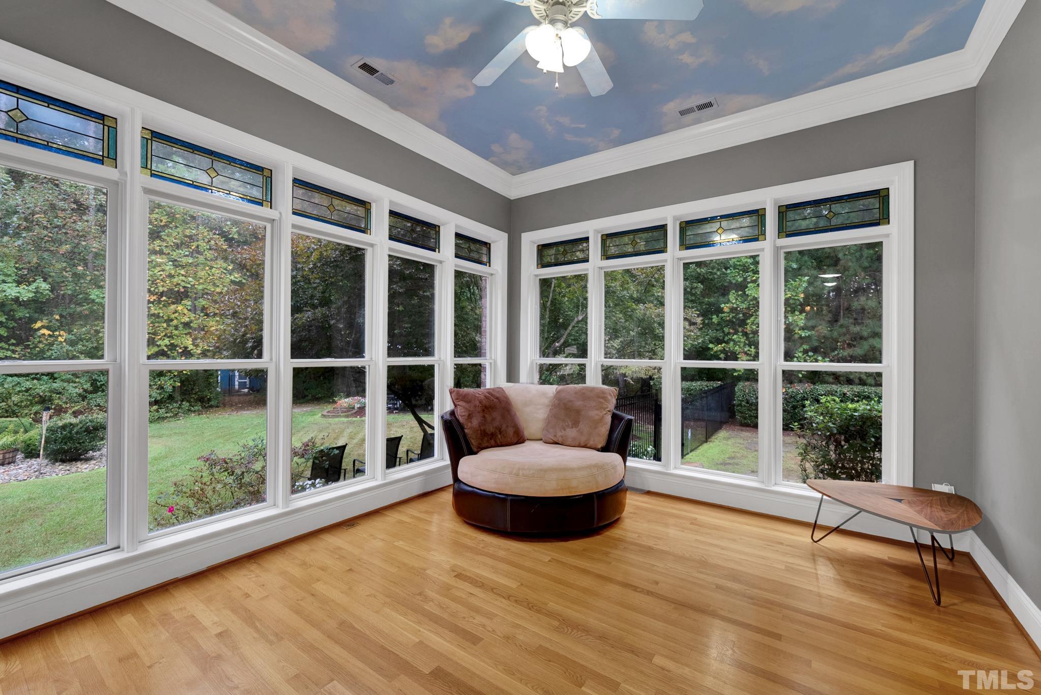 3249 Grand Oak Lane New Hill, NC 27562 - Photo 20 of 65 a living room filled with furniture and a large window