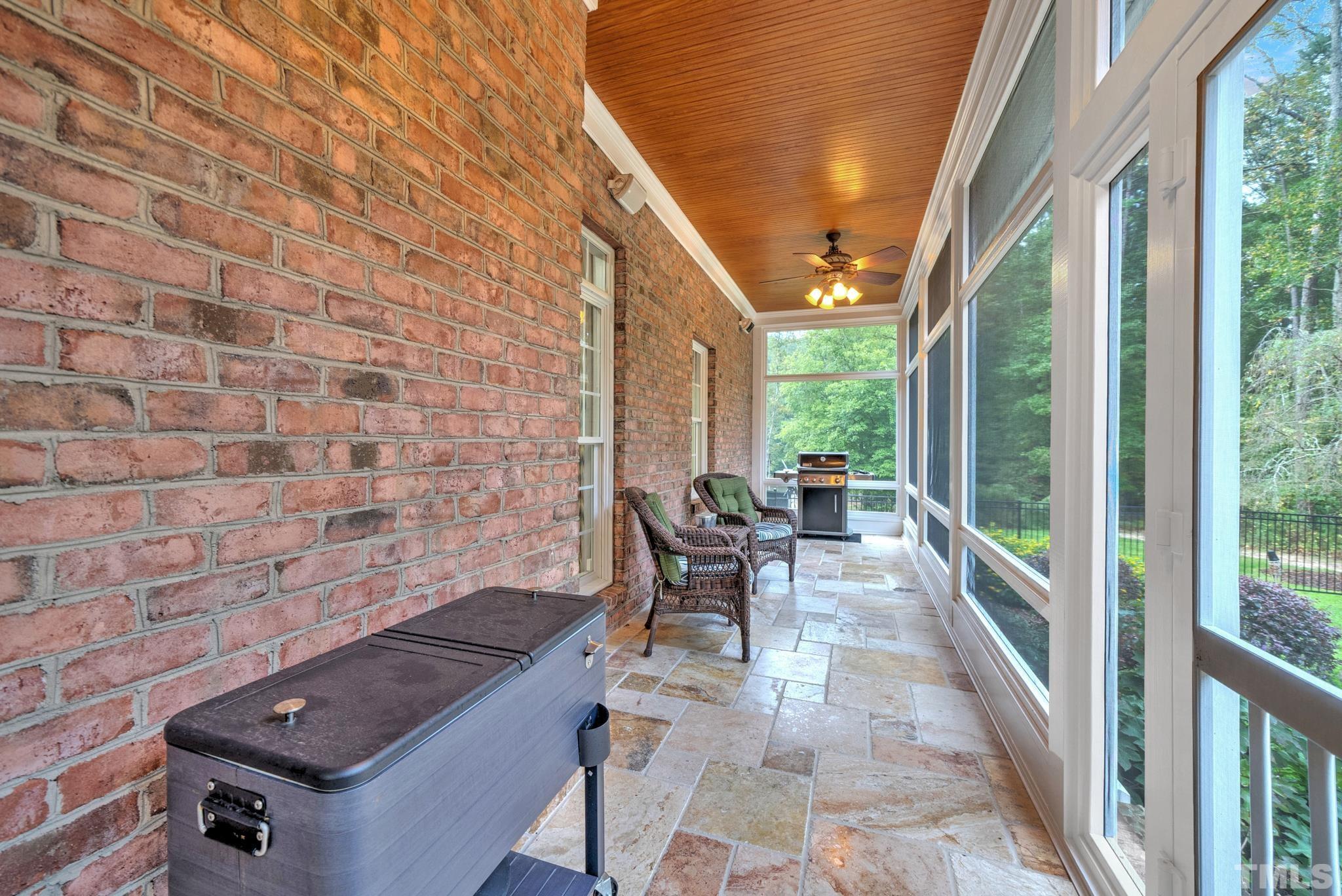 3249 Grand Oak Lane New Hill, NC 27562 - Photo 37 of 65 a view of a patio with a table and chairs