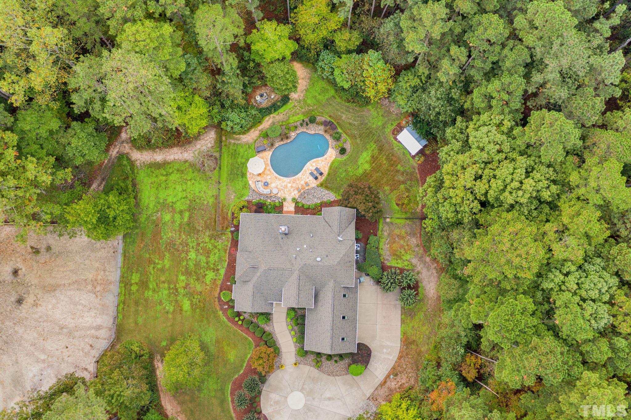 3249 Grand Oak Lane New Hill, NC 27562 - Photo 41 of 65 an aerial view of a house with a yard and large tree