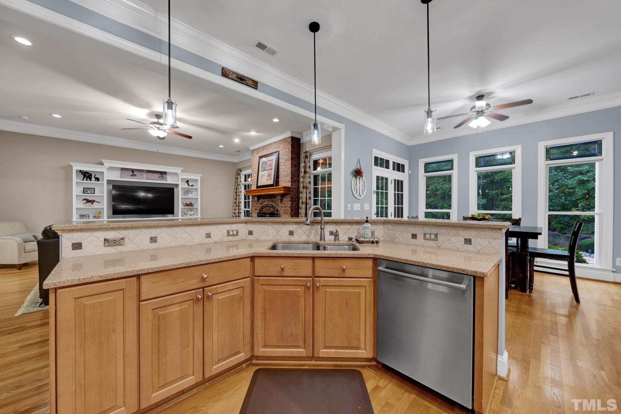 3249 Grand Oak Lane New Hill, NC 27562 - Photo 52 of 65 a kitchen with lots of counter space and a sink
