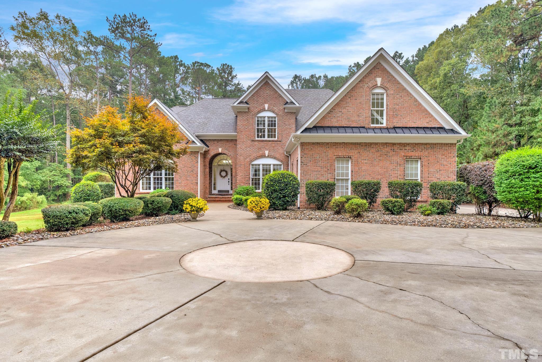 3249 Grand Oak Lane New Hill, NC 27562 - Photo 64 of 65 front view of house with a yard