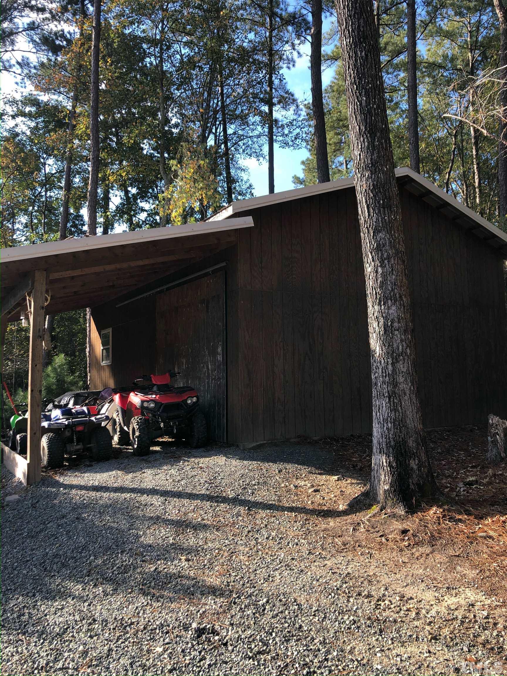 3249 Grand Oak Lane New Hill, NC 27562 - Photo 65 of 65 a view of parked car in front of a road