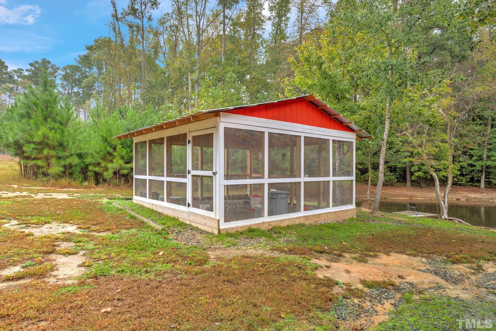 3249 Grand Oak Lane New Hill, NC 27562 - Photo 9 of 65 a view of a house with a yard and sitting area