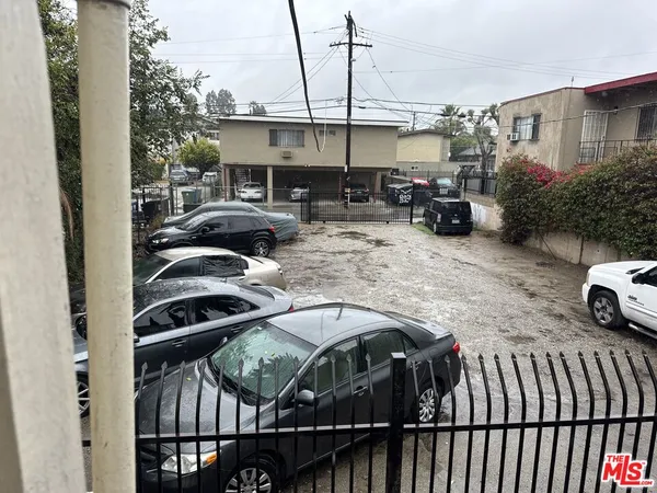 a view of a car park in front of house